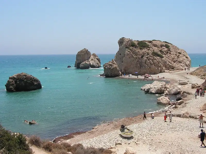 Travel guide to Cyprus featuring Aphrodite's Rock sea stack along the Mediterranean coastline of Paphos