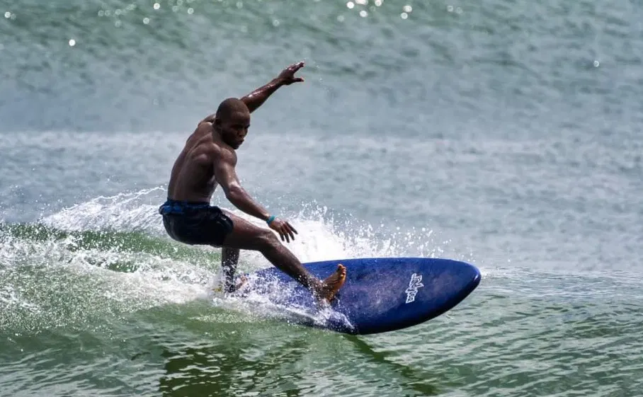 Travel guide to Liberia featuring the tropical coastline and palm trees of Robertsport