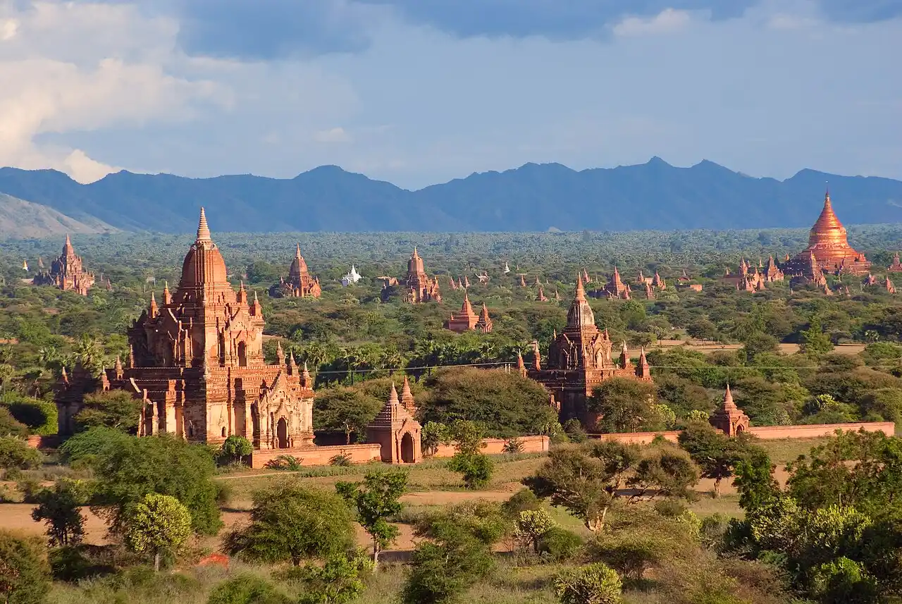 Travel guide to Myanmar featuring ancient pagodas scattered across the misty plains of Bagan at sunrise