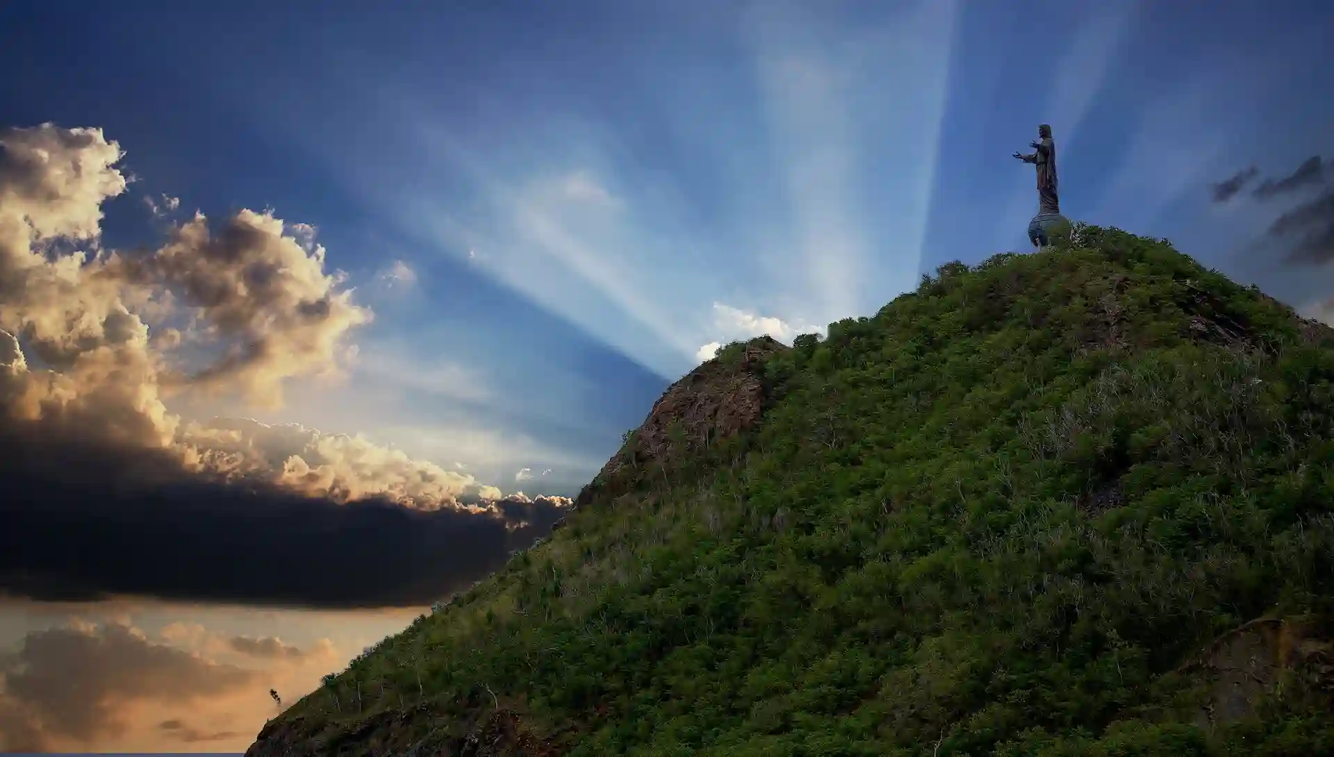Travel guide to Timor-Leste featuring Cristo Rei statue and the Dili coastline