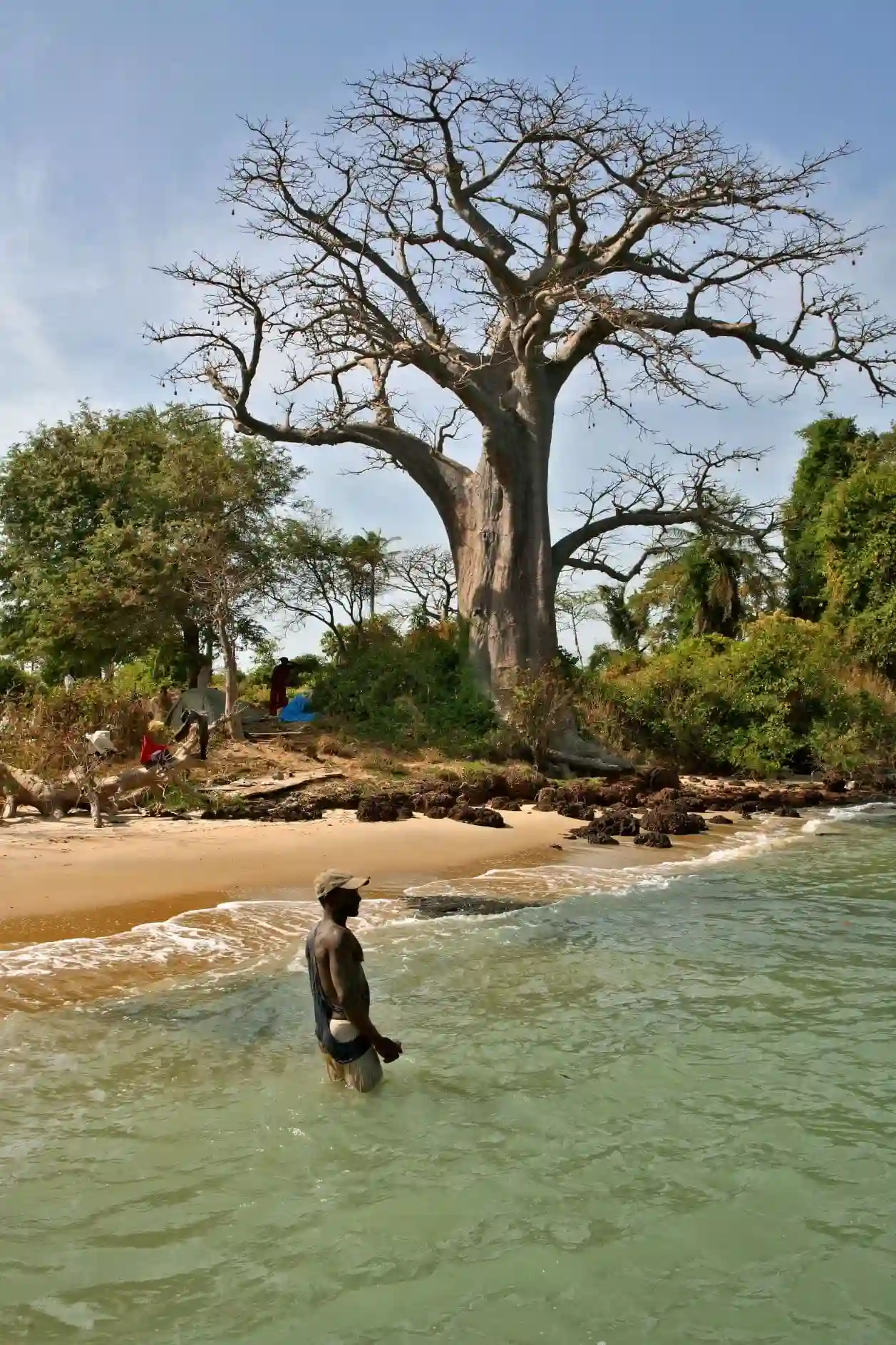 Travel guide to Guinea-Bissau featuring pristine palm-fringed beaches and turquoise waters of the Bijagós Islands