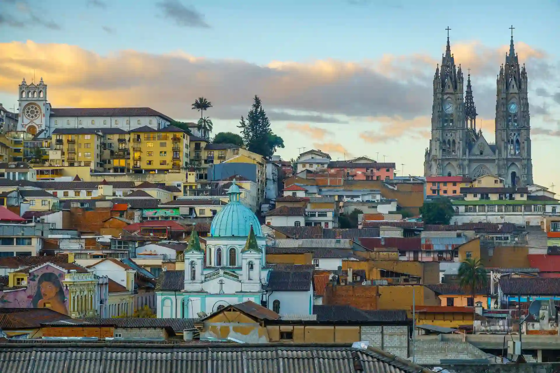 Travel guide to Ecuador featuring iconic historic colonial churches and cobblestone streets in Quito's UNESCO Old Town with Andean peaks in the background