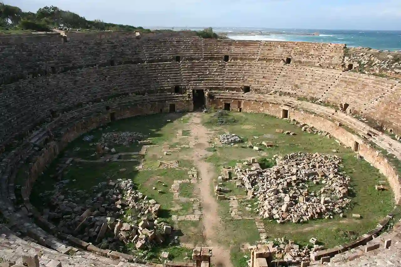 Travel guide to Libya featuring the historic Roman ruins and arches of Leptis Magna