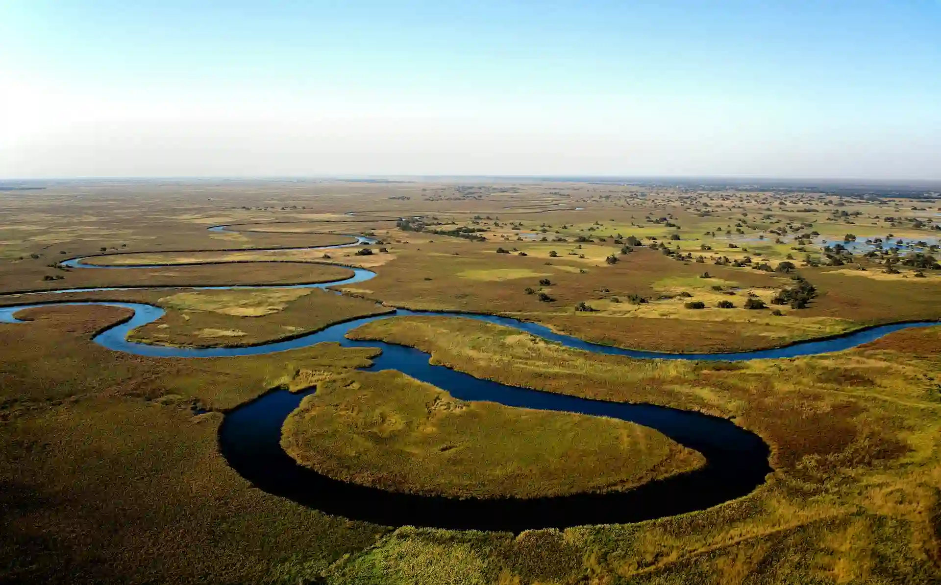 Travel guide to Botswana featuring an aerial view of the Okavango Delta channels