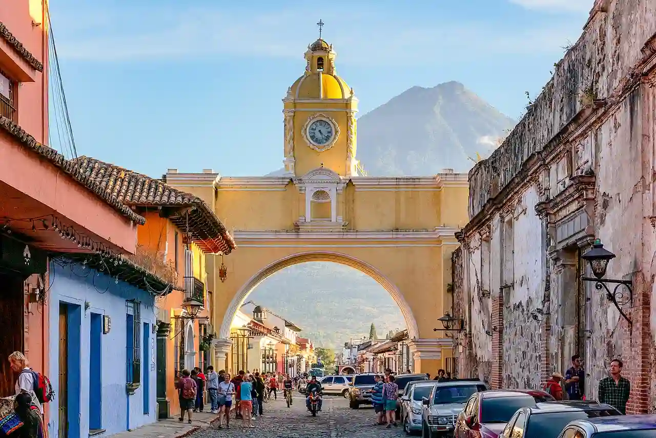 Travel guide to Guatemala featuring the iconic Santa Catalina Arch in Antigua with Agua Volcano framing the background