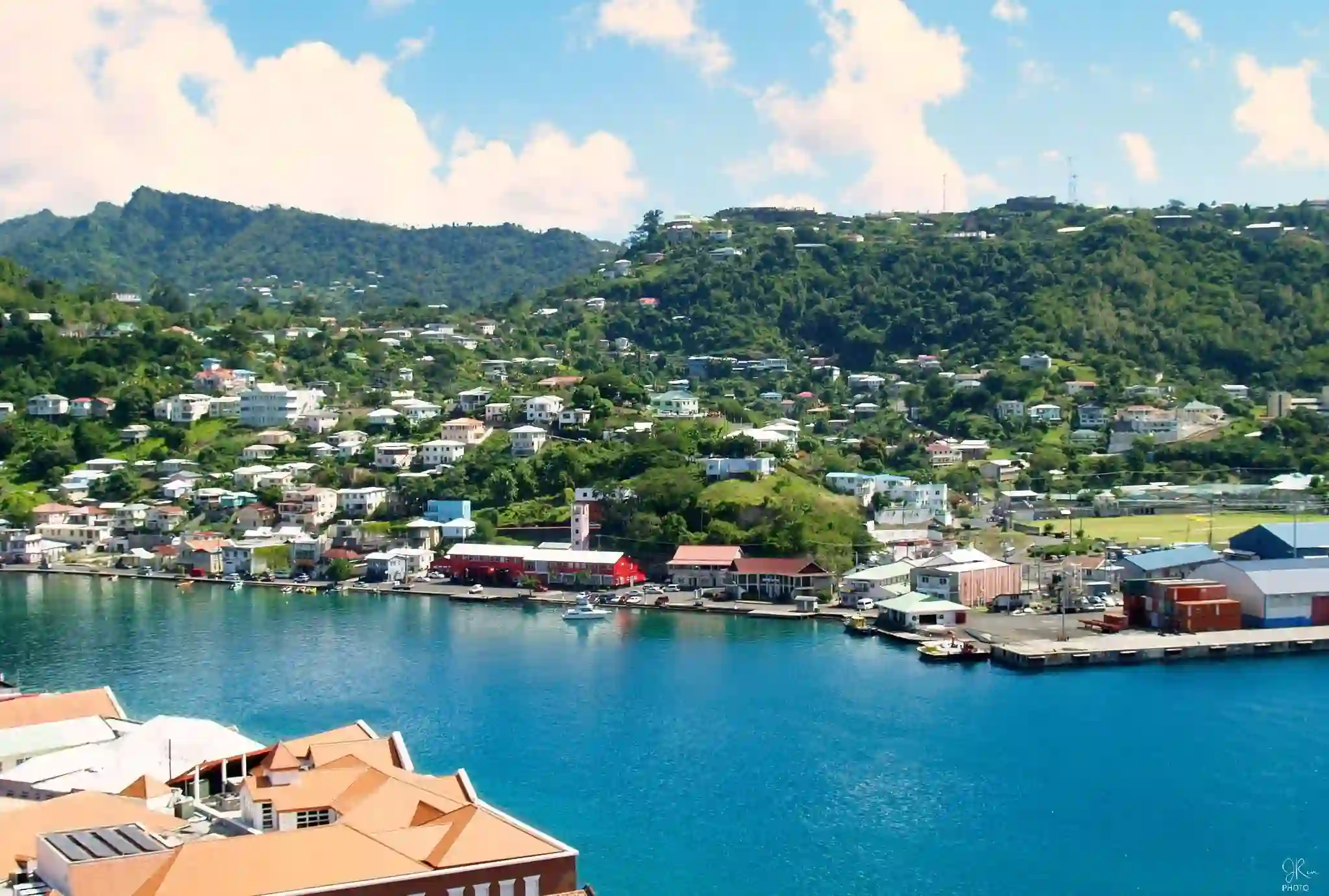 Travel guide to Grenada featuring the colorful harbor and horseshoe coastline of St. George's capital town