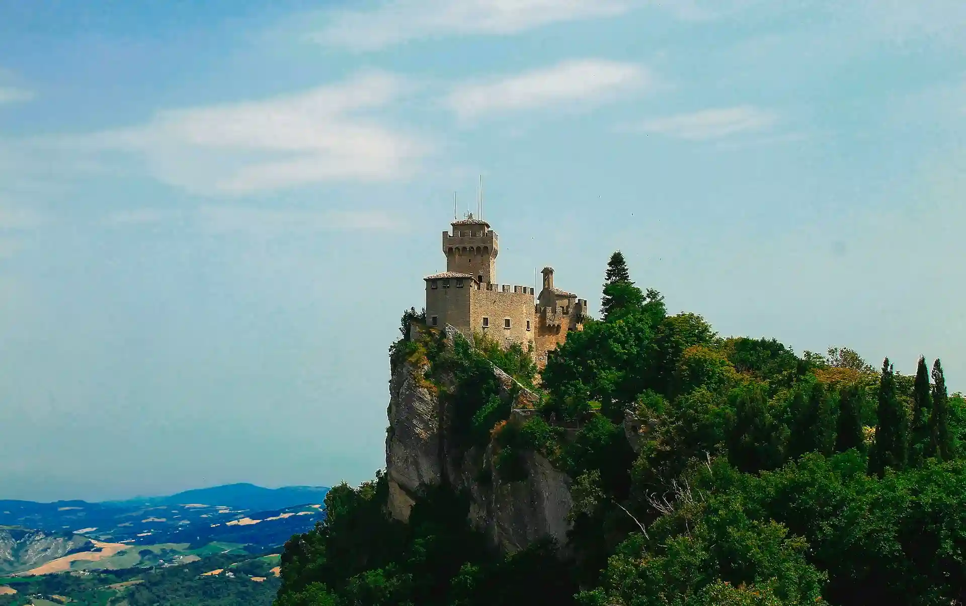 Travel guide to San Marino featuring the Three Towers of Monte Titano and panoramic views