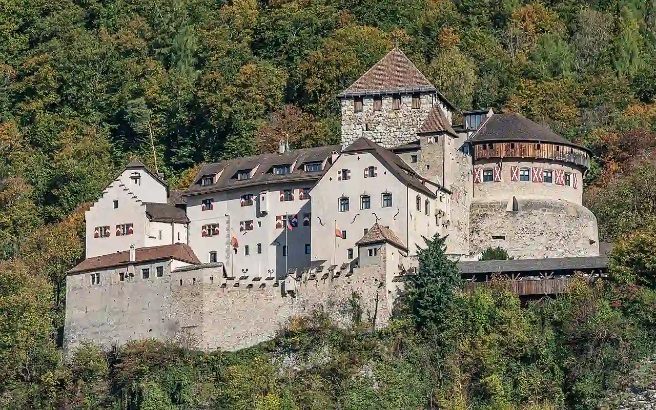 Travel guide to Liechtenstein featuring Vaduz Castle overlooking the capital and Alps