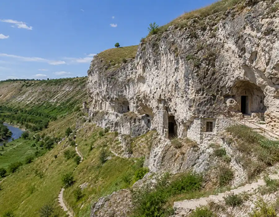 Travel guide to Moldova featuring the cliffside Orthodox monastery complex at Orheiul Vechi