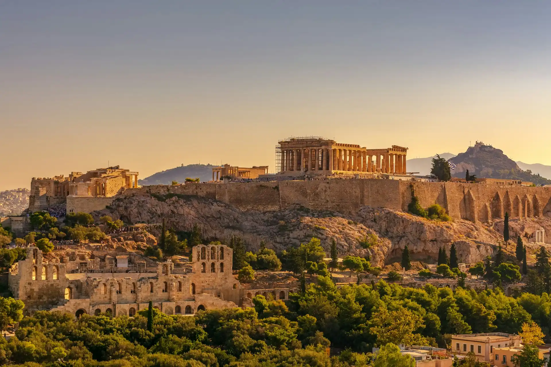 Travel guide to Greece featuring the Acropolis and Athens skyline